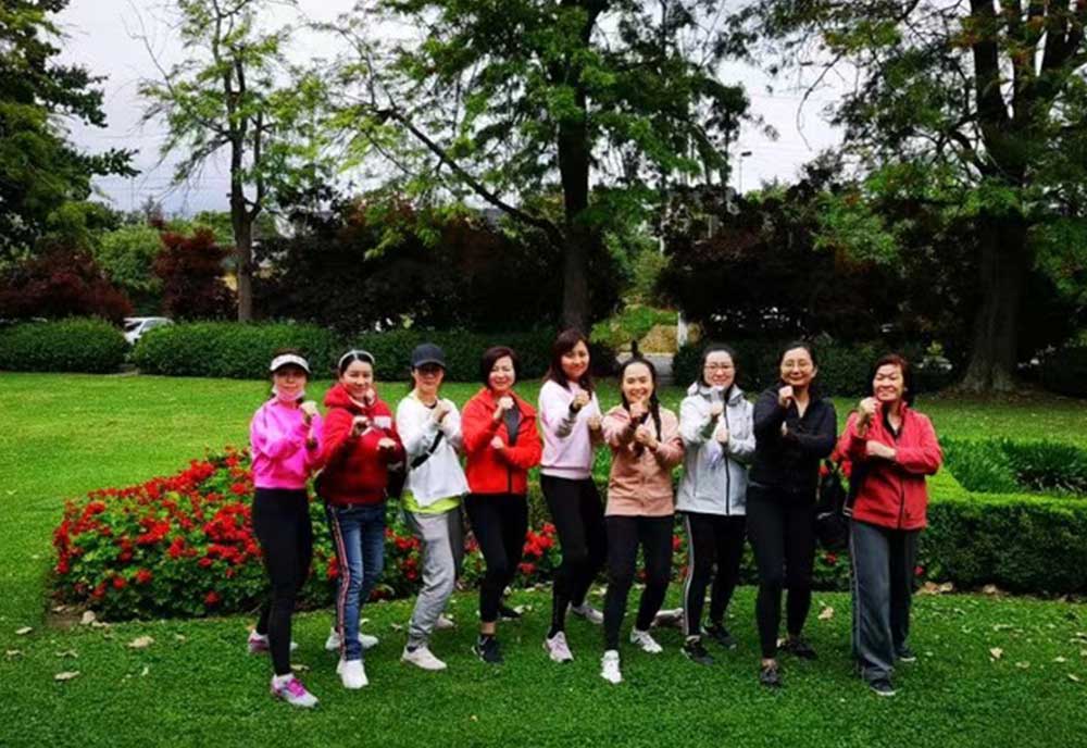 Women training kung fu in the park 2020